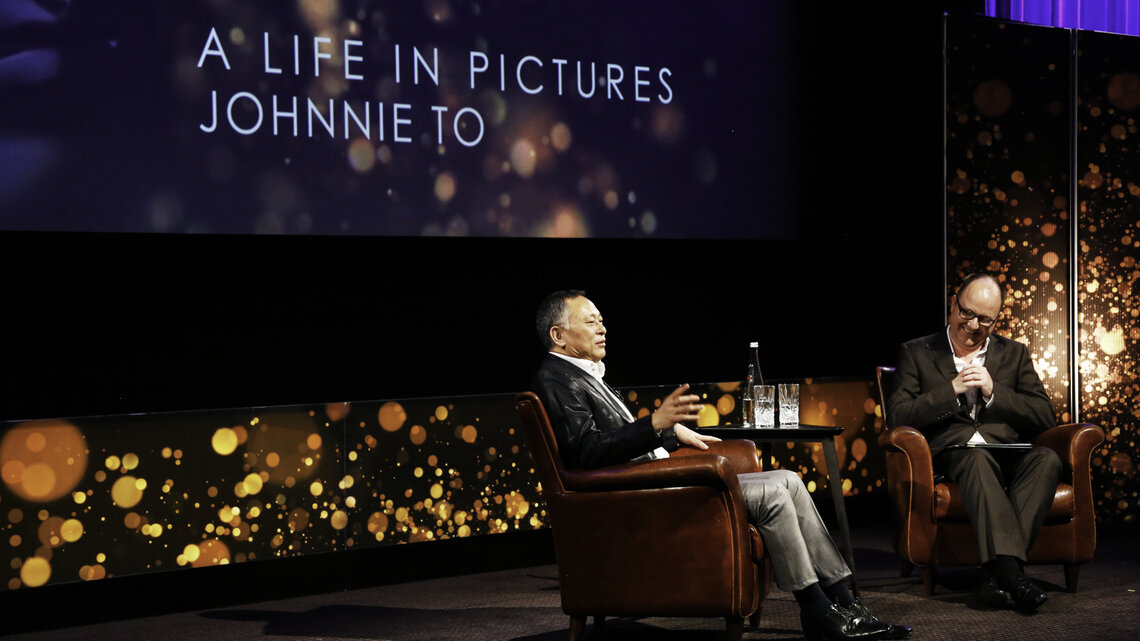 Event: BAFTA A Life in Pictures: Johnnie To sponsored by Create Hong Kong and Hong Kong Film Development Fund, supported by Brand Hong Kong and Hong Kong Economic and Trade Office, LondonDate: Monday 22 June,  2015Venue: BAFTA, 195 PiccadillyHost: Dunca