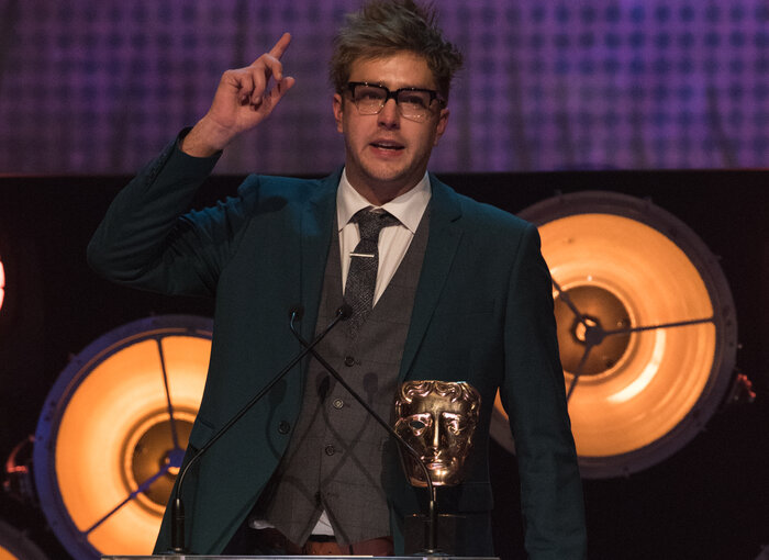 Iain Stirling accepts the award